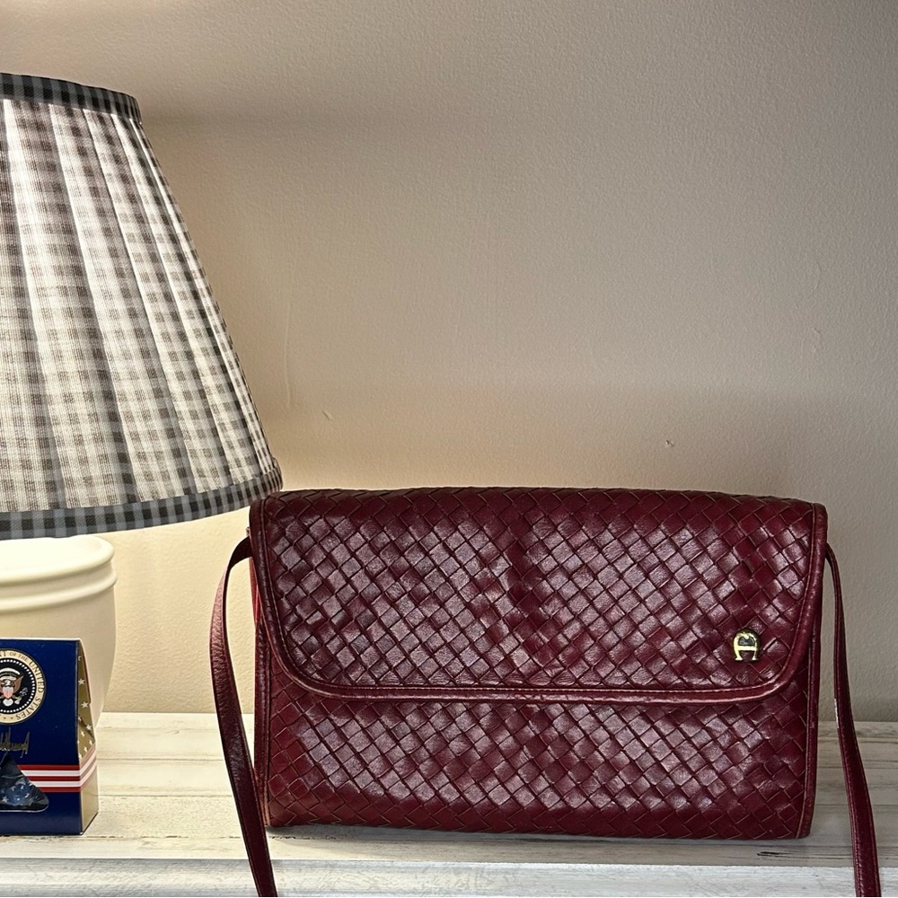SOLD.     Entienne Aigner Wine Woven crossbody